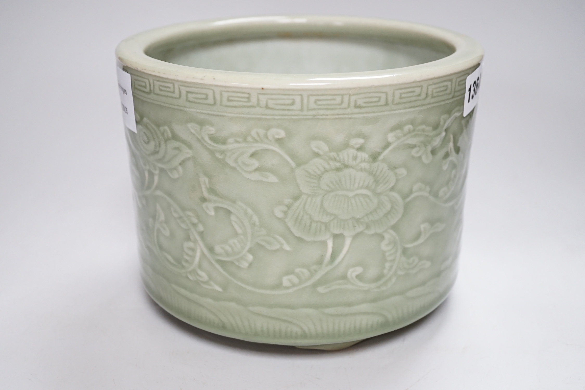 A Chinese celadon glazed tripod brushpot, 19th century